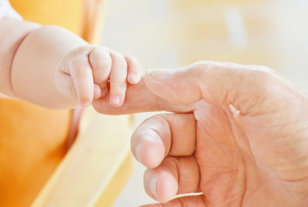 parent and baby fingers